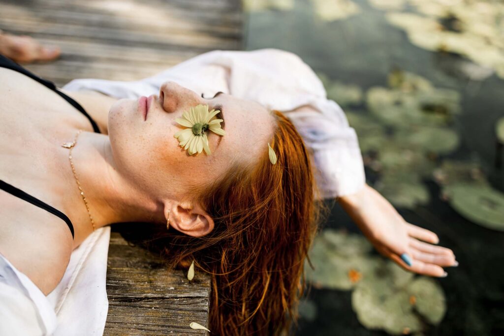 beautiful-young-woman-with-long-red-hair-in-the-wa-CB8NMU4.jpg